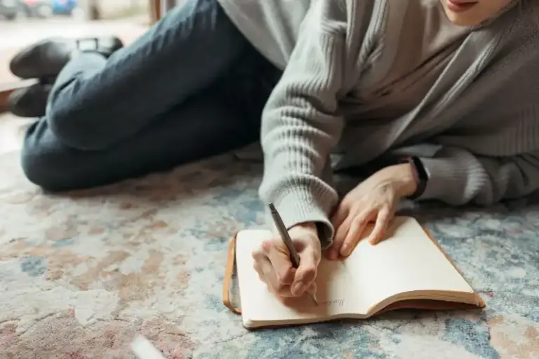 a person writing a journal entry