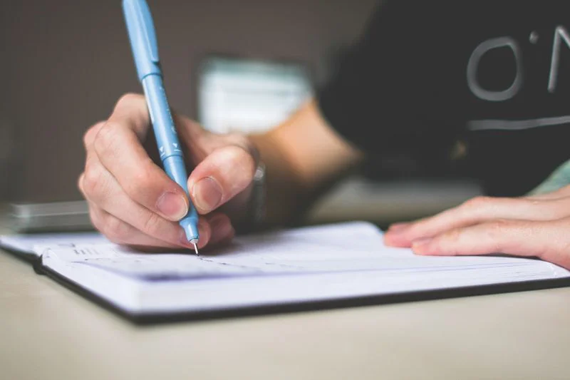 a view of someone journaling